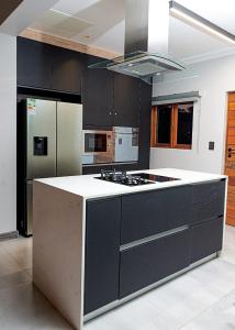 a kitchen with a white counter top and a refrigerator at Kruger Park Lodge Unit 268 - PMP in Hazyview