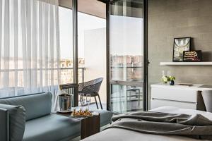 a bedroom with a bed and a view of a city at Pullman Paris Tour Eiffel in Paris