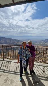two women standing on top of a mountain at Fayz Guest House in Samarkand