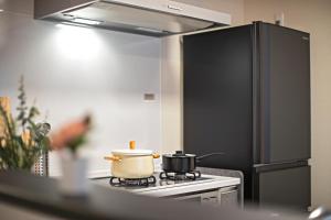 Een keuken of kitchenette bij -旅タイム 玉出東- 岸里玉出駅