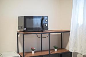 Een keuken of kitchenette bij -旅タイム 玉出東- 岸里玉出駅