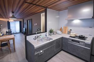 Een keuken of kitchenette bij -旅タイム 玉出東- 岸里玉出駅