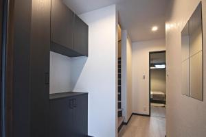 Een keuken of kitchenette bij -旅タイム 玉出東- 岸里玉出駅