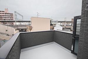 Een balkon of terras bij -旅タイム 玉出東- 岸里玉出駅