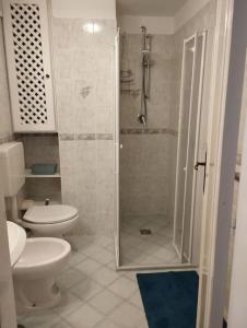 a bathroom with a shower and a toilet at Casa Nannina in Ischia Town +7 photos