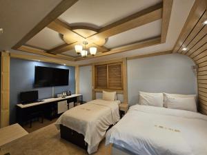 Postel nebo postele na pokoji v ubytování Hotel G7 Daejeon