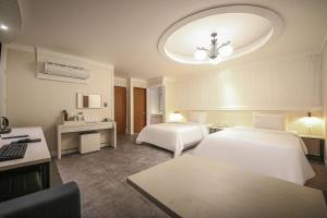 Postel nebo postele na pokoji v ubytování Hotel G7 Daejeon
