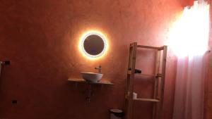 a bathroom with a sink and a mirror on the wall at Atena B&B APARTMENTS Imperial in San Silvestro