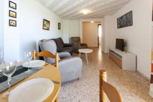 a living room with a couch and a table at Bahamas in Caserío La Estación