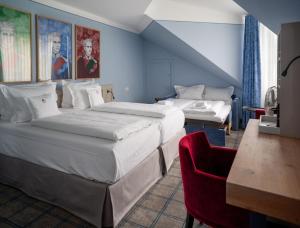 Postel nebo postele na pokoji v ubytování Hotel König Ludwig II