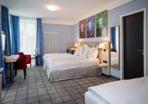 Postel nebo postele na pokoji v ubytování Hotel König Ludwig II