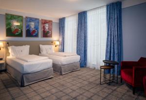 Postel nebo postele na pokoji v ubytování Hotel König Ludwig II