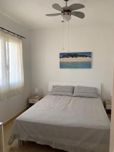 Ένα ή περισσότερα κρεβάτια σε δωμάτιο στο Villetta PEPE nel Salento