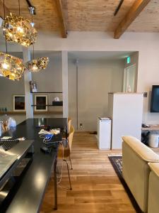 a kitchen and living room with a table and a refrigerator at Abuta-gun - House - Vacation STAY 14526 in Kutchan