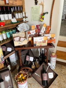 a table filled with lots of bottles of wine at Ficarazzi in Morano Calabro +15 photos