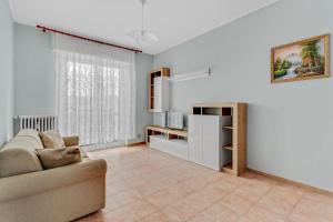 a living room with a couch and a table at FA 333 - Spacious apartment with views of Milan - in Milan