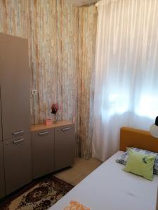 Postel nebo postele na pokoji v ubytování Apartman Centar 2