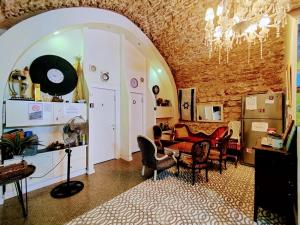 a room with a table and chairs in a room at PoliHosts Old Jaffa in Tel Aviv