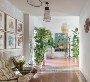 a living room filled with lots of plants at Mason & Fifth, Bermondsey in London