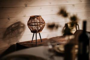 a vase sitting on a table in a room at Sunset Stodoły w Bieszczadach in Ustrzyki Dolne