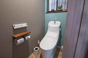 a bathroom with a white toilet in a room at 旅time 住吉大社 Sumiyoshi shrine in Osaka