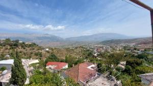 a view of a city with mountains in the background at Relax Camping in Gjirokastër