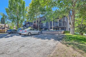 a car parked in a parking lot in front of a house at NEW LISTING!! Breck Mountain Magic condo in Breckenridge