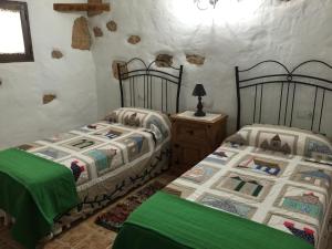 Posteľ alebo postele v izbe v ubytovaní Casa Abuelo Rafael