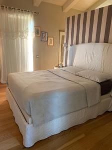 Postel nebo postele na pokoji v ubytování CA' SAN LUISS