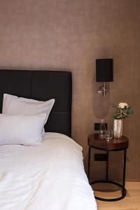 Postel nebo postele na pokoji v ubytování Hotel Groenendaal