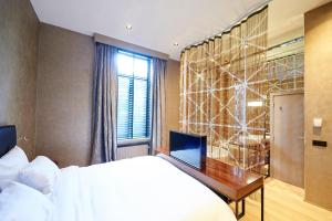 Postel nebo postele na pokoji v ubytování Hotel Groenendaal