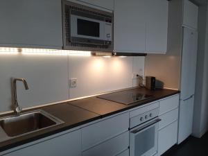 A kitchen or kitchenette at Marta & Lorenzo Apartment. Fuerteventura