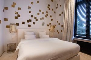 Postel nebo postele na pokoji v ubytování Hotel Groenendaal