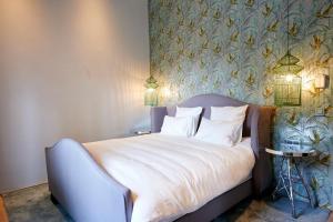 Postel nebo postele na pokoji v ubytování Hotel Groenendaal