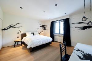 Postel nebo postele na pokoji v ubytování Hotel Groenendaal