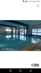 a picture of a swimming pool in a building at studio montagne in Les Orres
