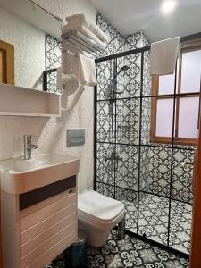 a small bathroom with a toilet and a sink at DIMORA HOTEL in Istanbul