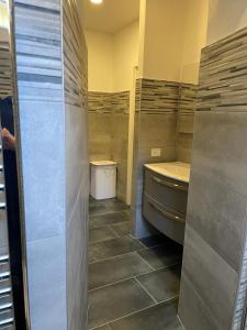 a bathroom with a sink and a toilet in it at La casa del lago di lecco in Lecco