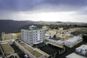 an aerial view of a city with buildings at فندق بيرلي ابها in Abha