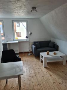 a living room with a couch and a table at Fe Wo Nele in Alsfeld