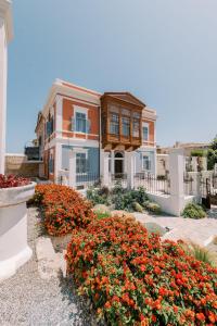 a house with a bunch of flowers in front of it at Saray Monumental Luxury Villa Medieval Town, Rhodes in Rhodes Town