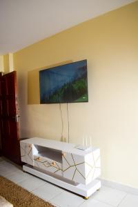 a white coffee table in a room with a wall at Elegant Furnished 2 bedroom Apartment in Nairobi Ngara in Nairobi