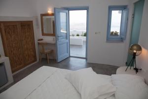 Cama ou camas em um quarto em Fanari Vista Suites