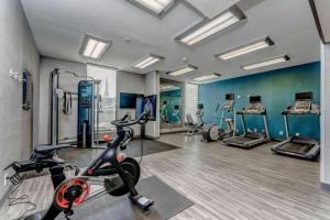 a gym with a treadmill and a bike in a room at Hampton Inn Morgantown in Morgantown