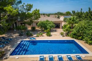 an overhead view of a swimming pool in front of a house at Ideal Property Mallorca - Can Ribas in Can Picafort