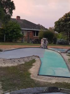 The swimming pool at or close to Warradale Lodge and Mini Golf