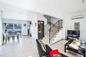 a living room with a couch and a table at Villa Delia in Protaras