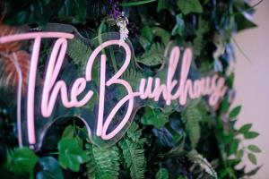 a pink neon sign that reads the billion at The Bunkhouse in South Shields