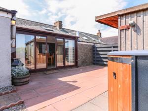 an internal view of a house with a glass extension at Rowan Cottage in Arbroath