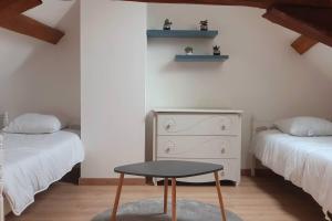 Postel nebo postele na pokoji v ubytování Gîte Les Fourmilières
